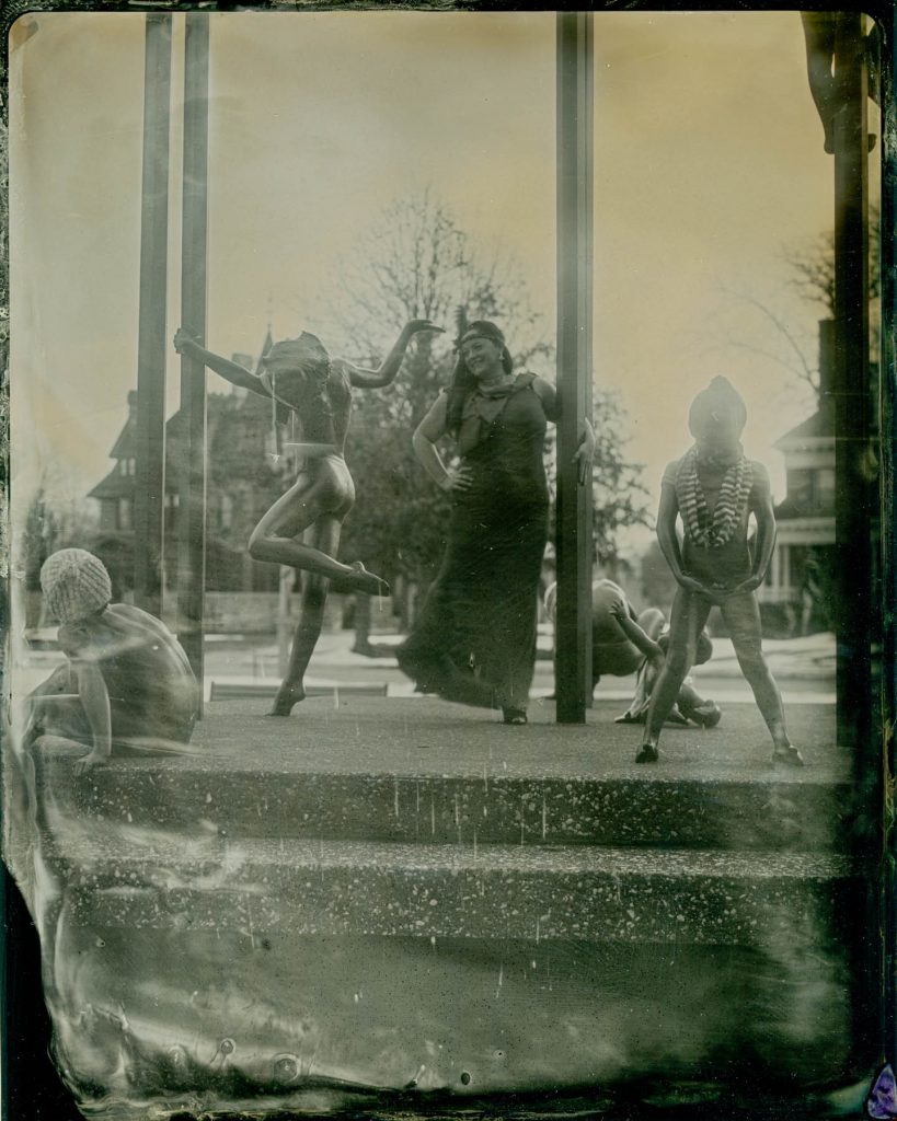 tintype of woman model dancing in a fountain