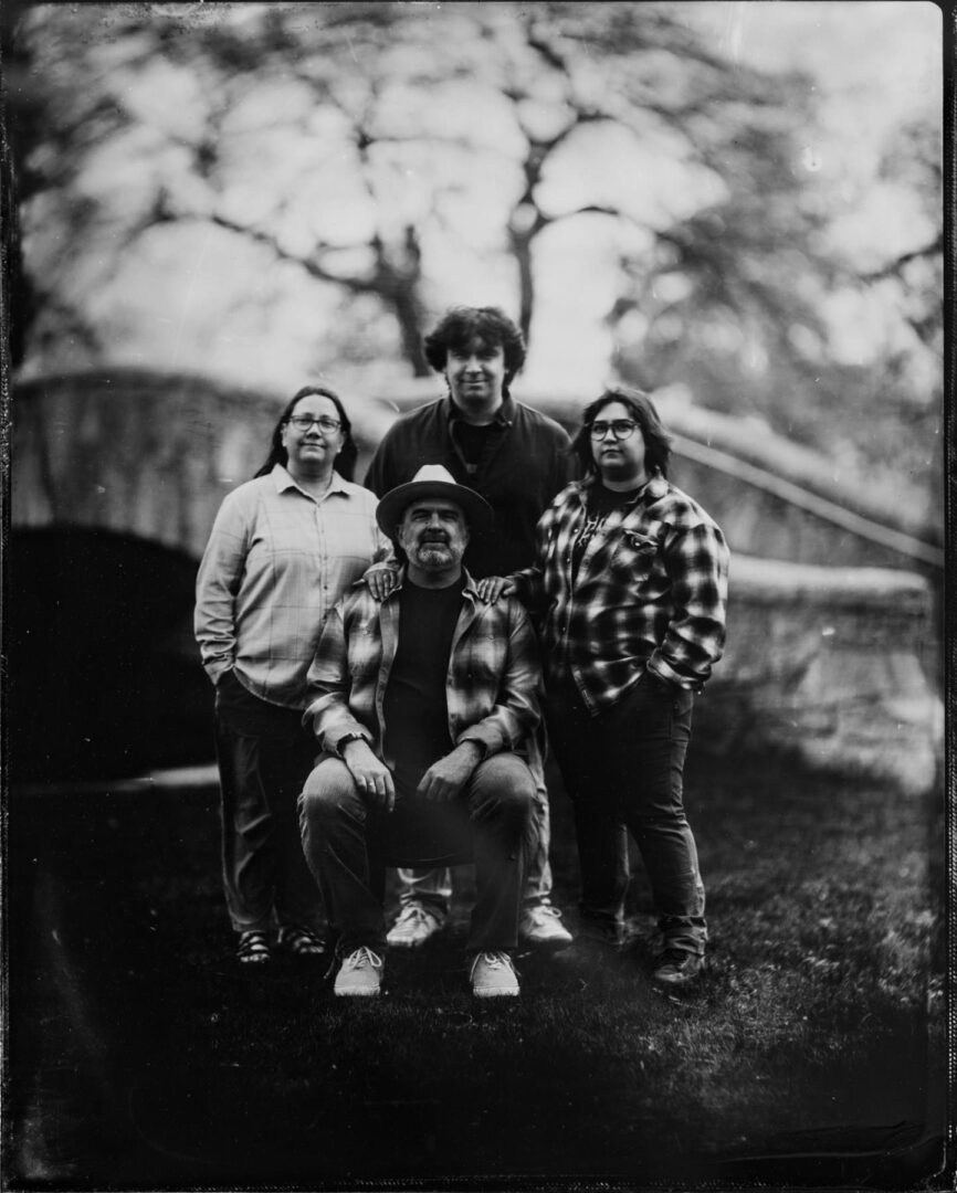 tintype family portrait with that sweet Petzval lens swirl