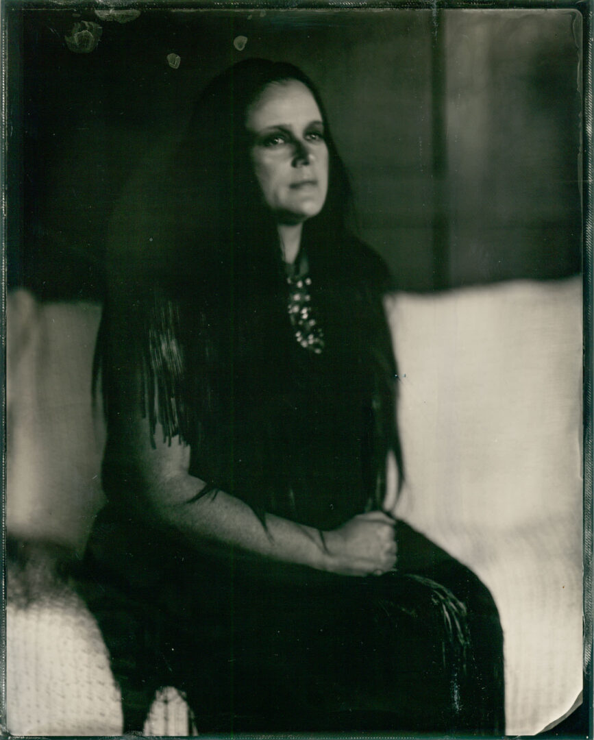 tintype portrait of a woman in black dress