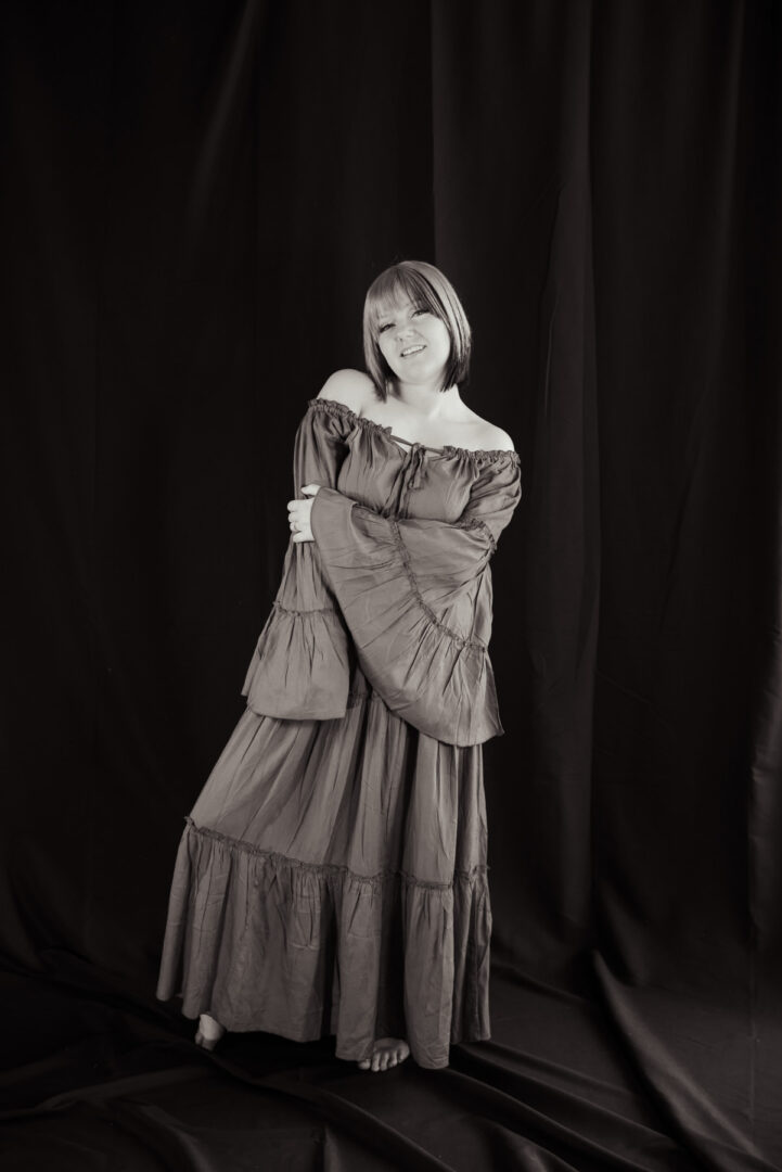 Black and White portrait of a woman in a green dress
