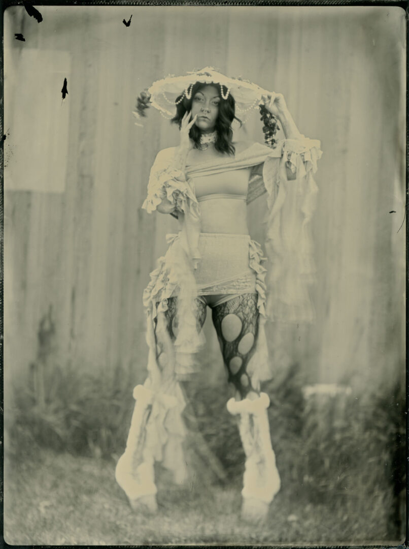 Tintype of a woman in a white outfit
